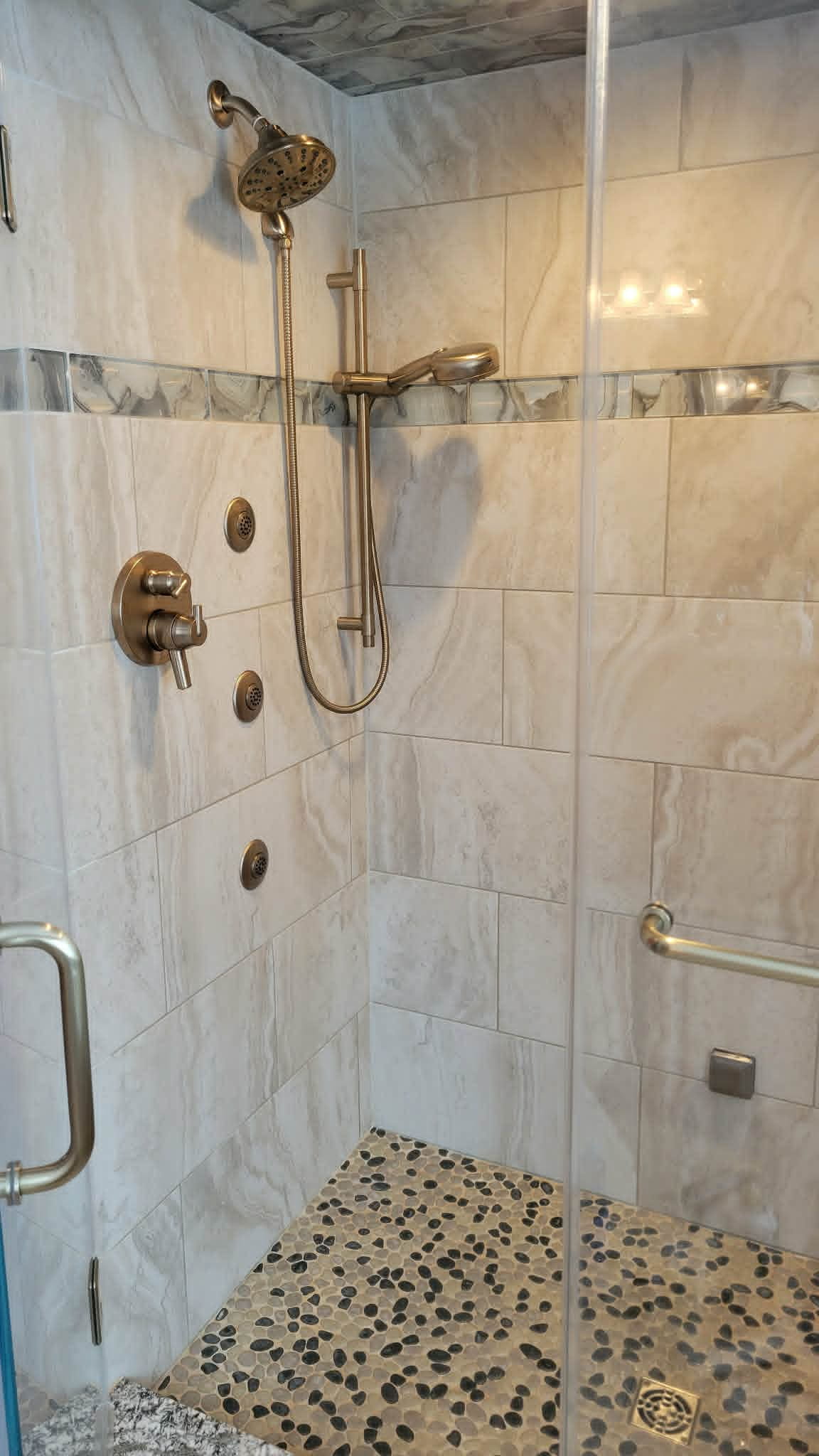 A spotless tiled walk-in shower