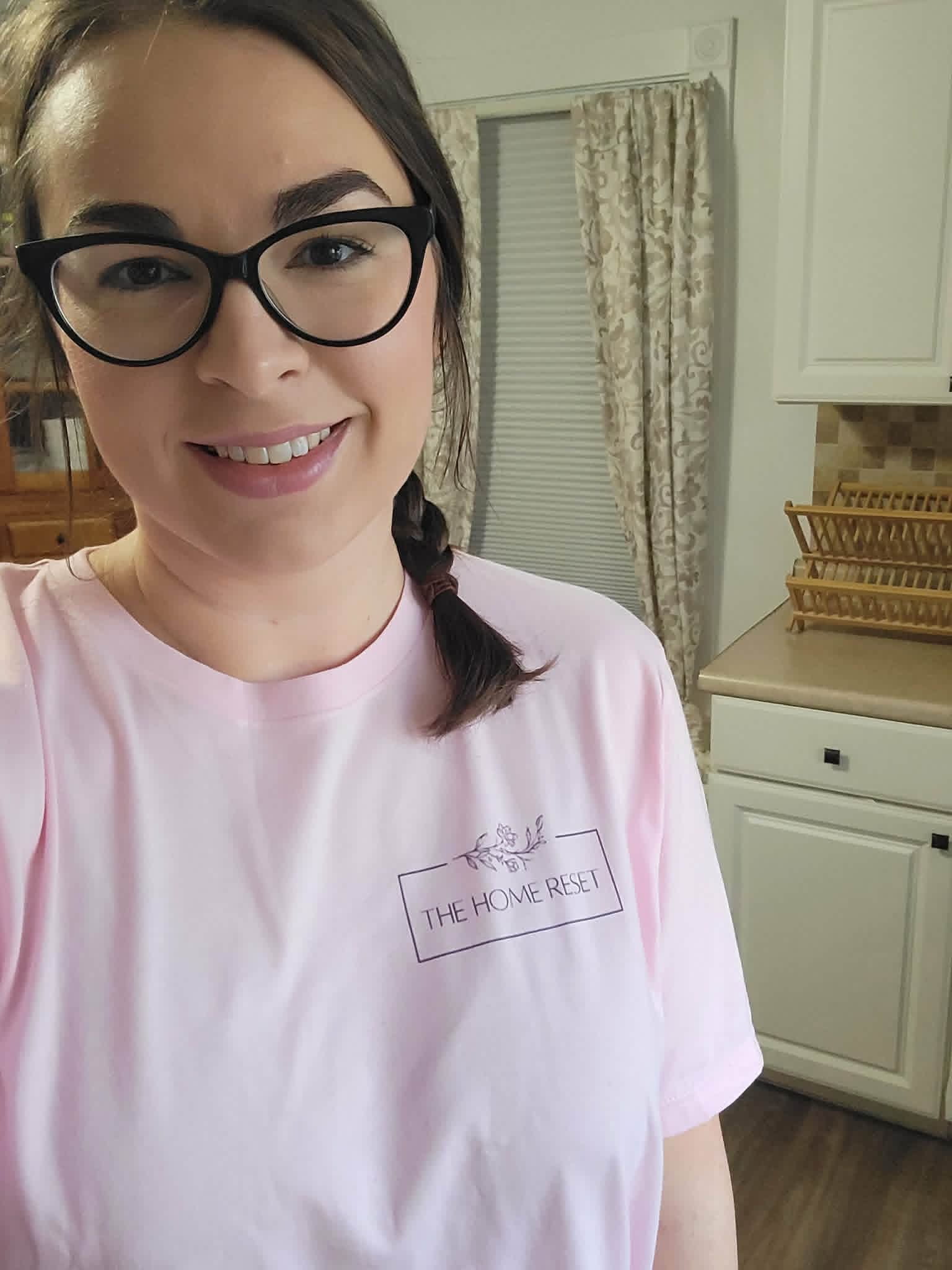 Tess McClintic, owner of The Home Reset LLC, in a branded company shirt